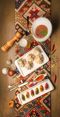 Hot Georgian khinkali with meat and cold lobio