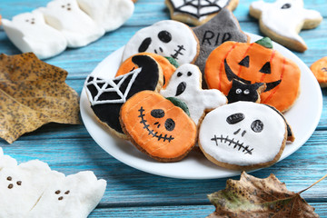 Fresh halloween gingerbread cookies on blue wooden table