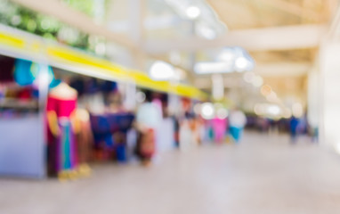 Blurred image of people walking at day market