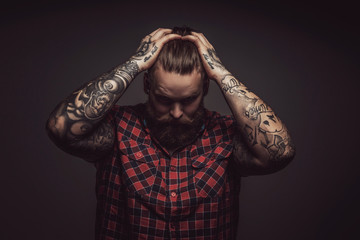 Man with beard looking down.