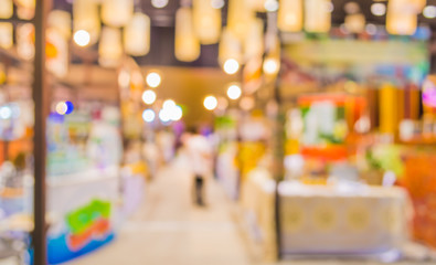 blurred image of people at trade show