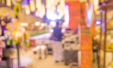 blurred image of people at trade show