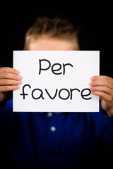 Child holding sign with Italian word Per Favore - Please