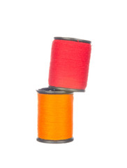 Colourful red and orange thread isolated on white background