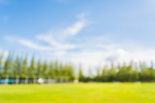 blurred image of soccer field at school on day time image