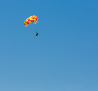 People parasailing over the sea
