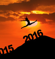 Silhouette woman jumping through numbers 2016