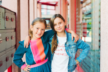 Outdoor portrait of adorable little girls