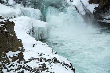 Closeup of frozen waterfall Godafoss, Iceland