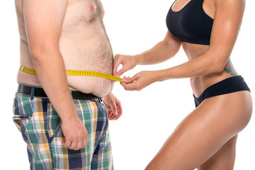 Coach holds the client waist measurement