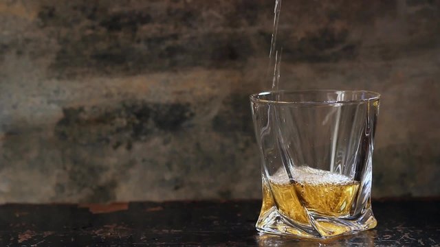 Pouring whiskey in glass