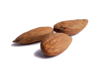 Three almonds isolated on white.
