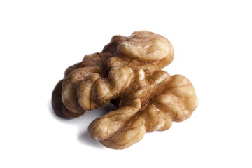 Peeled walnut isolated on white.