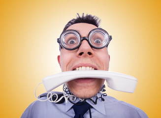 Crazy man with phone on white