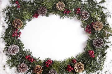 Christmas wreath in snow with copy space
