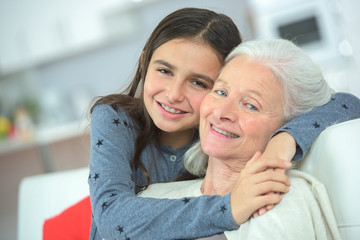 Hugging her grandma