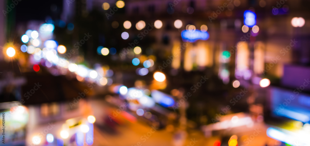 Wall mural image of blurred bokeh background with warm colorful night light