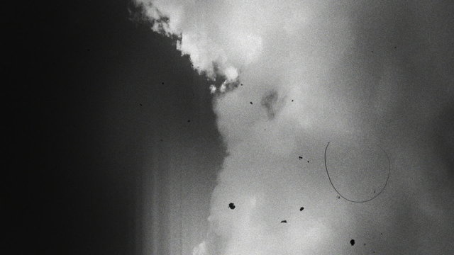 Clouds 1508: Old flickering black and white film footage of clouds.