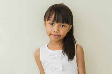 Happy little asian girl  isolated in white