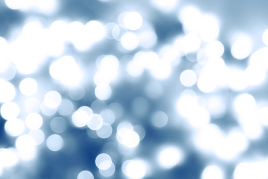 Abstract blue and white bokeh blurs background