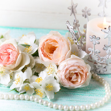 Sweet pastel  roses, jasmine flowers  and candle