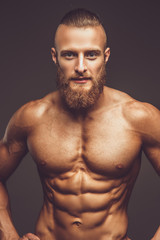 Fototapeta na wymiar Muscular man with beard.
