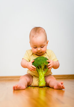 Healthy Living - Baby Eating Broccoli