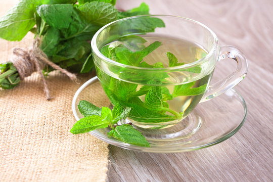 Cup of mint tea and a bunch of mint