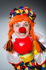 Funny clown in comical concept