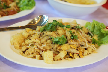 close up of Fried fish maw stir fry with egg and vegetable in ch