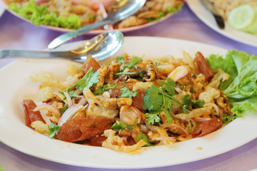 close up of crispy pork mixed with spicy salad (Yam Sam Krob), t