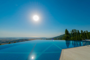 Infinity pool on the bright summer day