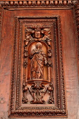 Detail of the old entrance door in Italian church