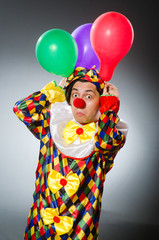 Funny clown in comical concept