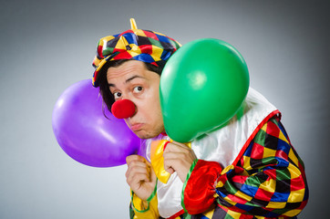 Funny clown in comical concept