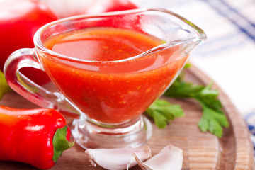 Tomato sauce in a glass gravy boat