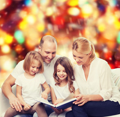 happy family with book at home