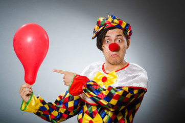 Funny clown in comical concept