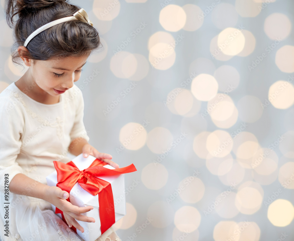 Sticker happy little girl with present over lights