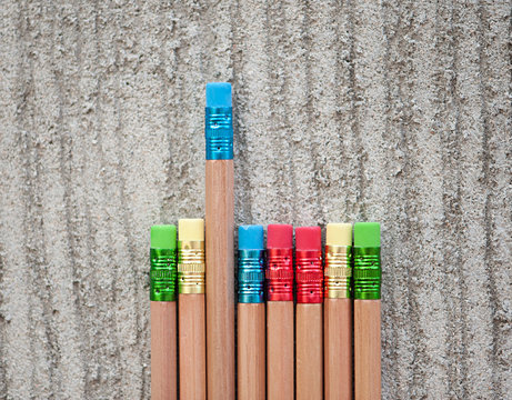Row of color pencils on grey  background.Studio shot