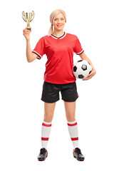 Fototapeta na wymiar Female soccer player holding a golden trophy