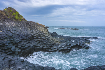 Waves splashing on stones from the Giant's Causeway 

