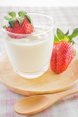 Glass of yogurt with fresh strawberry
