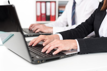 Businesspeople working on a laptop
