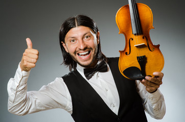 Man playing violin in musical concept