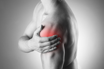Man with pain in shoulder. Pain in the human body