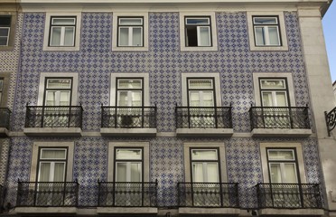 Traditional Portuguese facade, covered with azulejos blue tiles. Lisbon