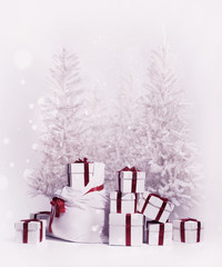 Christmas trees with bag and heap of gift boxes