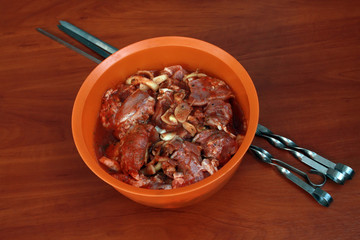 Chunks of raw meat with spices and onions. Marinated in tomato j