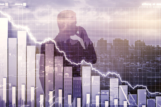 Double explosure with businessman talking on the phone and crisi